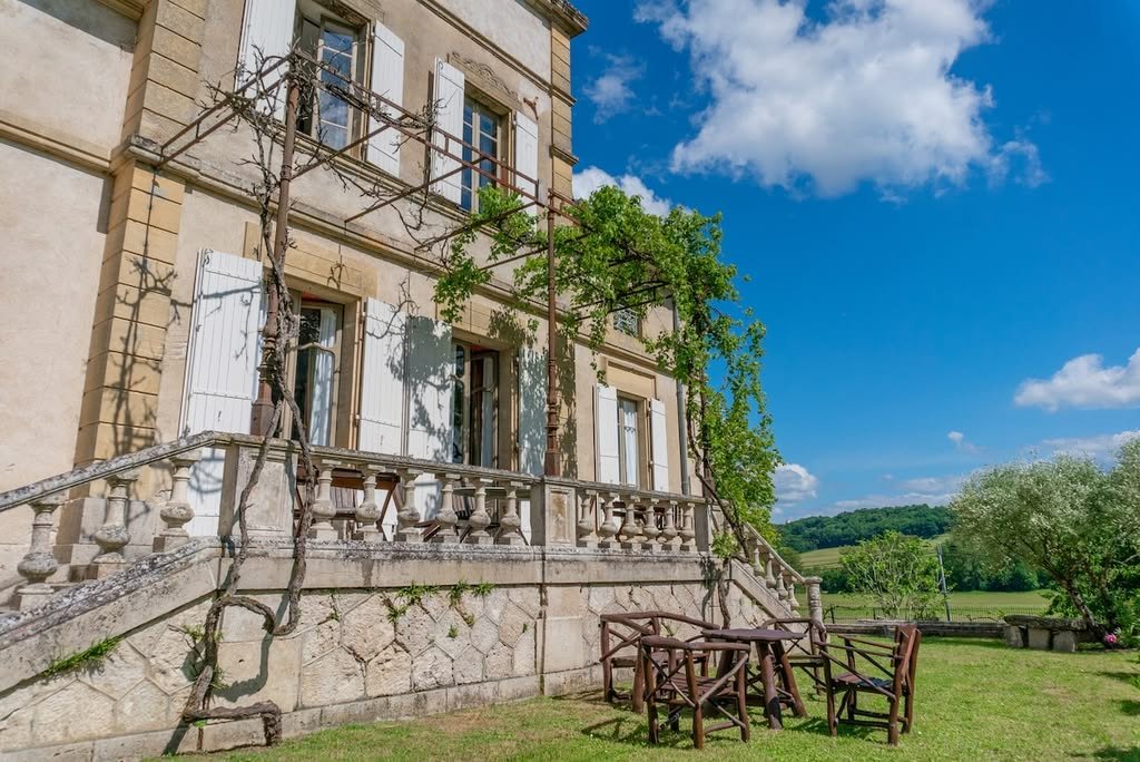 The terrace along the façade, with wisteria