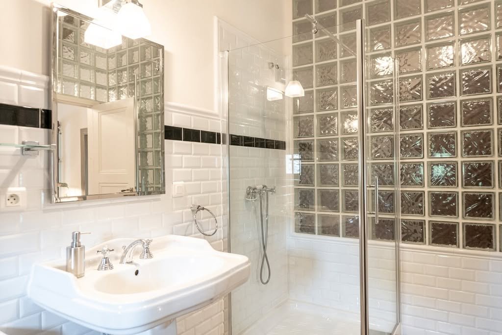 A bathroom with a walk-in shower