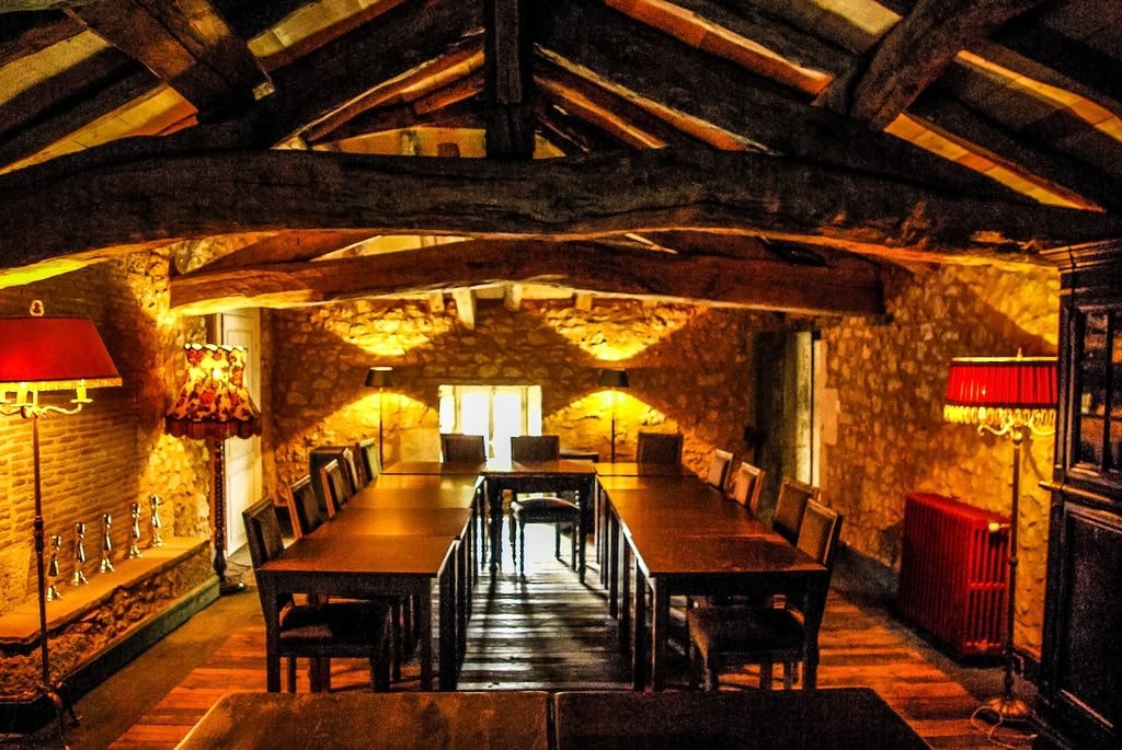 The dining room under the old timber beams, seating 30+